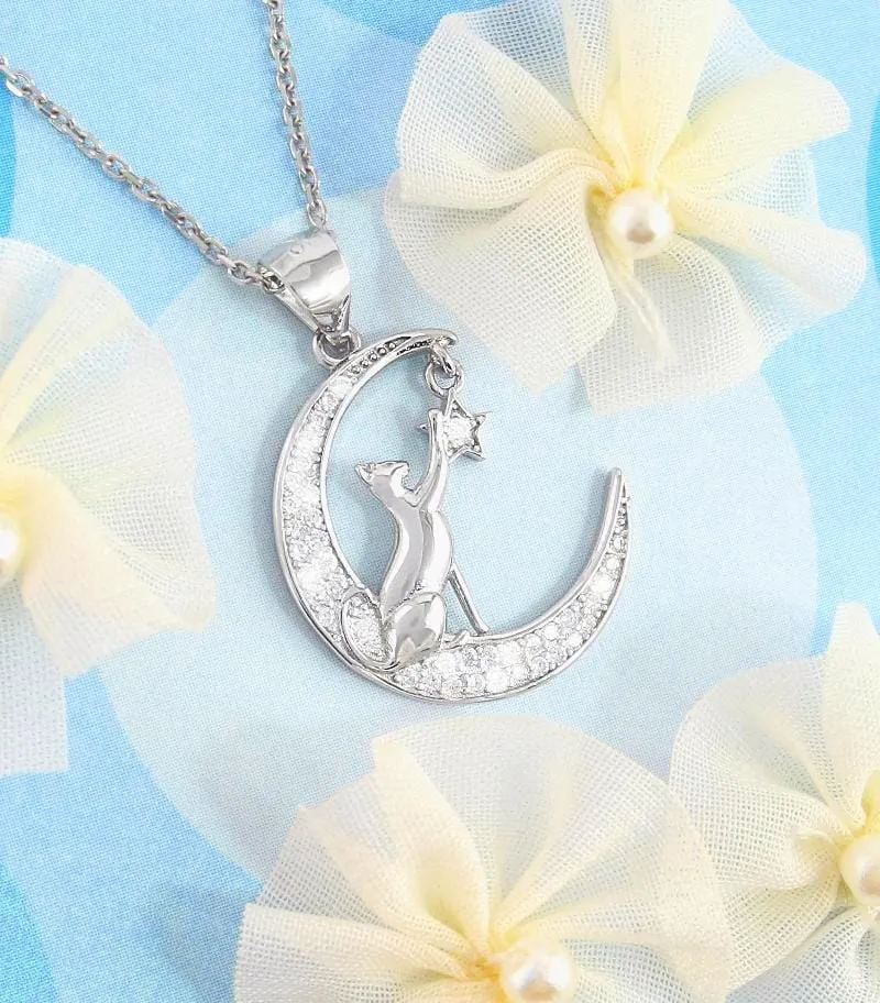 Cat Reaching for a Star on a Crescent Moon Pendant